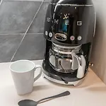 Stylish 4Bed Retreat With Rooftop, Garage, Peloton, Sleeps 12, Fire Table, Gourmet Kitchen, Cozy Living Space, Dedicated Parking, Near Distilleries, Marathon Village & Nightlife, Chic Skyline Views, 24 Hour Hospitality