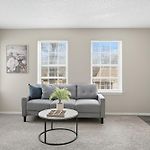 Spacious Living Room With Fireplace And Balcony