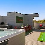 The Americana Abode Rooftop Hot Tub Game Room
