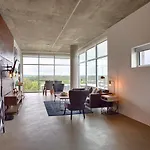 Gaze At Sprawling Green Vistas Through Walls Of Windows