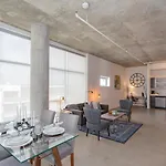 Gaze At Sprawling Green Vistas Through Walls Of Windows