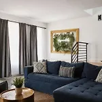 Stylish 3 Bed Retreat, Rooftop, Parking, Sleeps 10, Ensuite Baths, Bunk Room, Gourmet Kitchen, Cozy Living Space, Rooftop Views & Fire Table, Near Downtown, Distilleries & Marathon Village, 24 Hr Hospitality