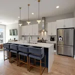 Two Townhomes Rooftop Lounges With Skyline Views