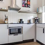 Holiday home Sleeps 44 4 Themed Lofts W Skyline Balconies Neon Backdrops Glam Kitchens—perfect For Group The Swift Retreat By Avantstay *