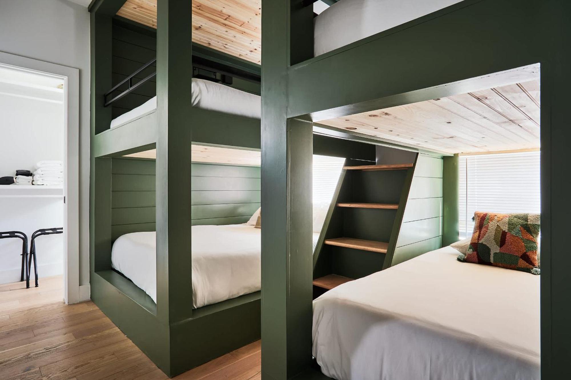 Stylish 3 Bed Retreat, Rooftop, Parking, Sleeps 10, Ensuite Baths, Bunk Room, Gourmet Kitchen, Cozy Living Space, Rooftop Views & Fire Table, Near Downtown, Distilleries & Marathon Village, 24 Hr Hospitality *