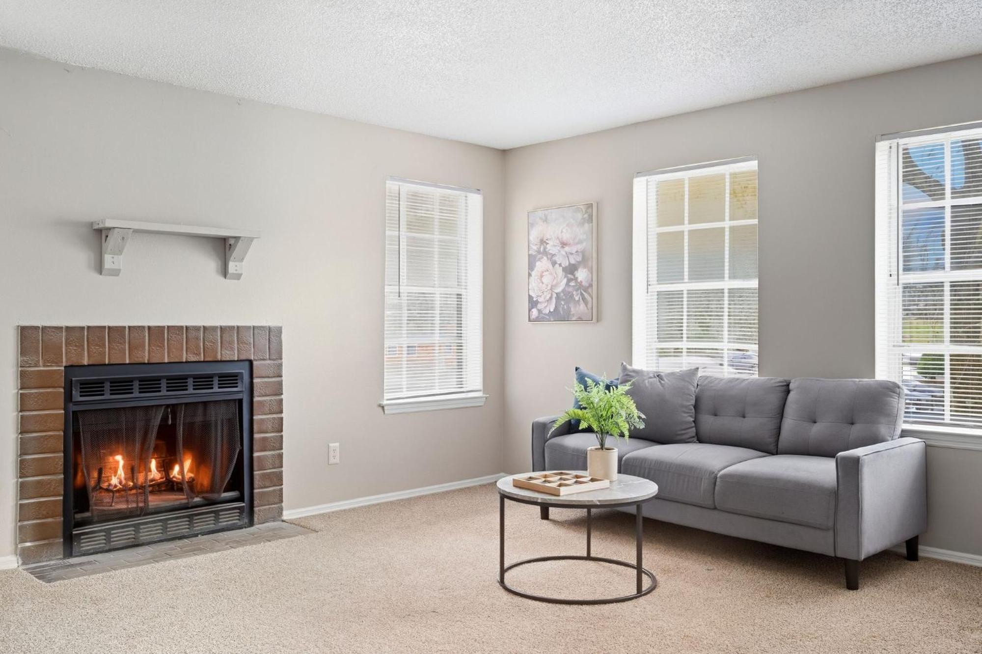 Spacious Living With Fireplace And Balcony